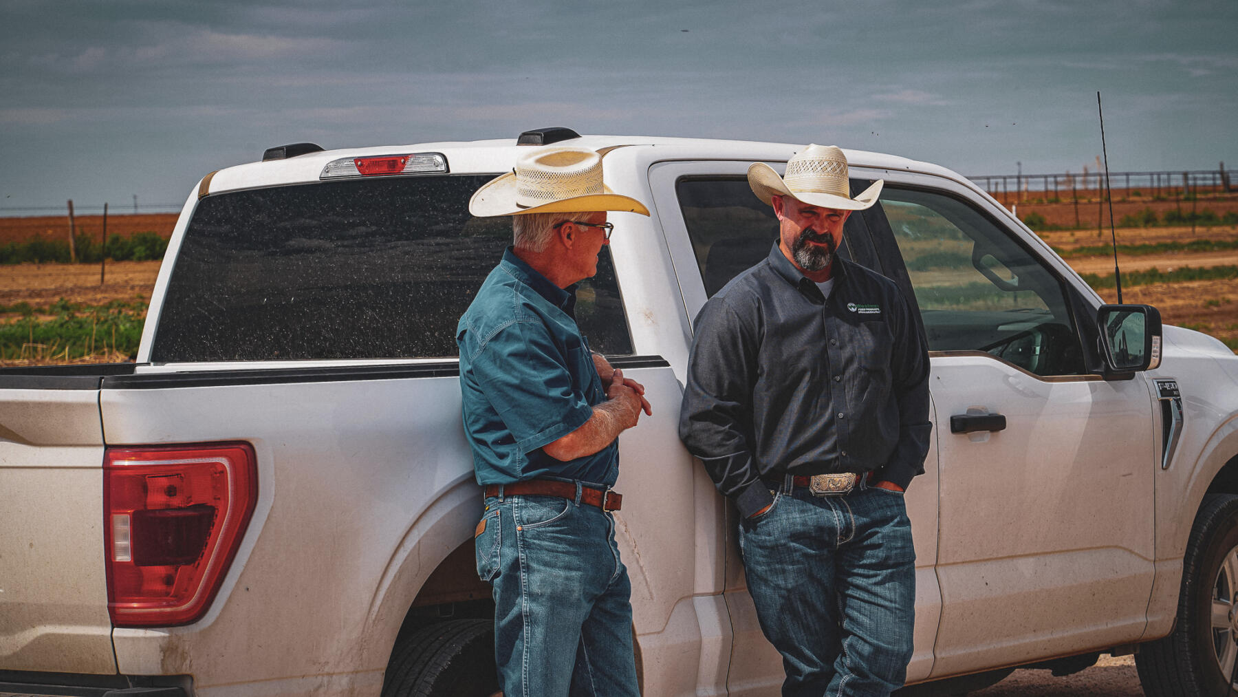 Brent Snyder Discussing Feed Solutions with Circle 3 Feedyards Owner Westway Feed Products sales rep discussing with customer in Hereford, Texas